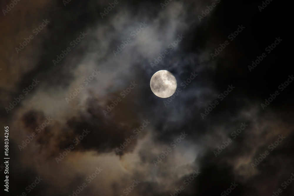 Night sky with full moon and floating cloud for background.