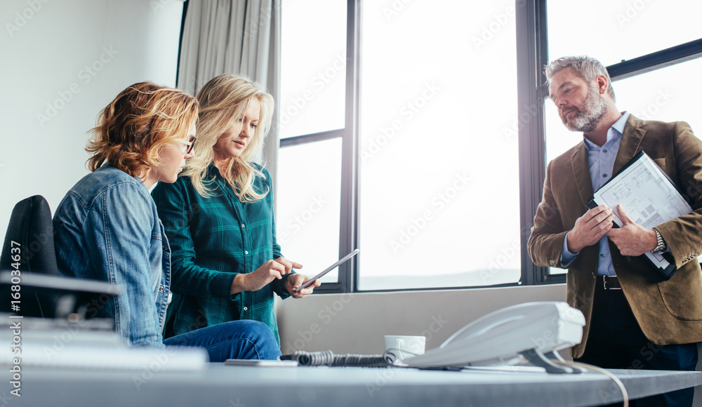 Business colleagues working in modern office Business colleagues working in modern office