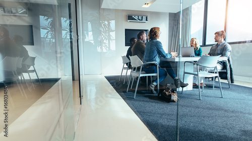 Group of business people having discussion in conference room