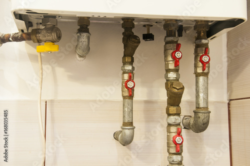 water pipes and valves connected to heating gas furnace