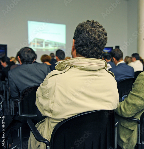 entrepreneurs attending a commercial presentation photo