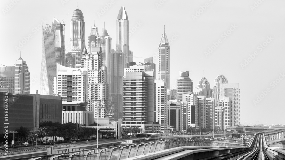 Fototapeta premium Old black and white film style picture of Dubai skyline.
