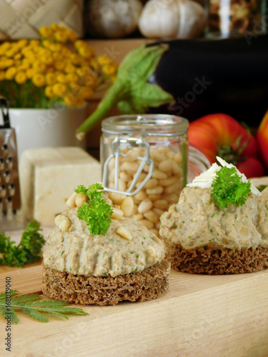 Canapes with meat, fish or vegetable pate surrounded by village style attributes