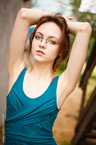 Young pretty women posing on old stairs