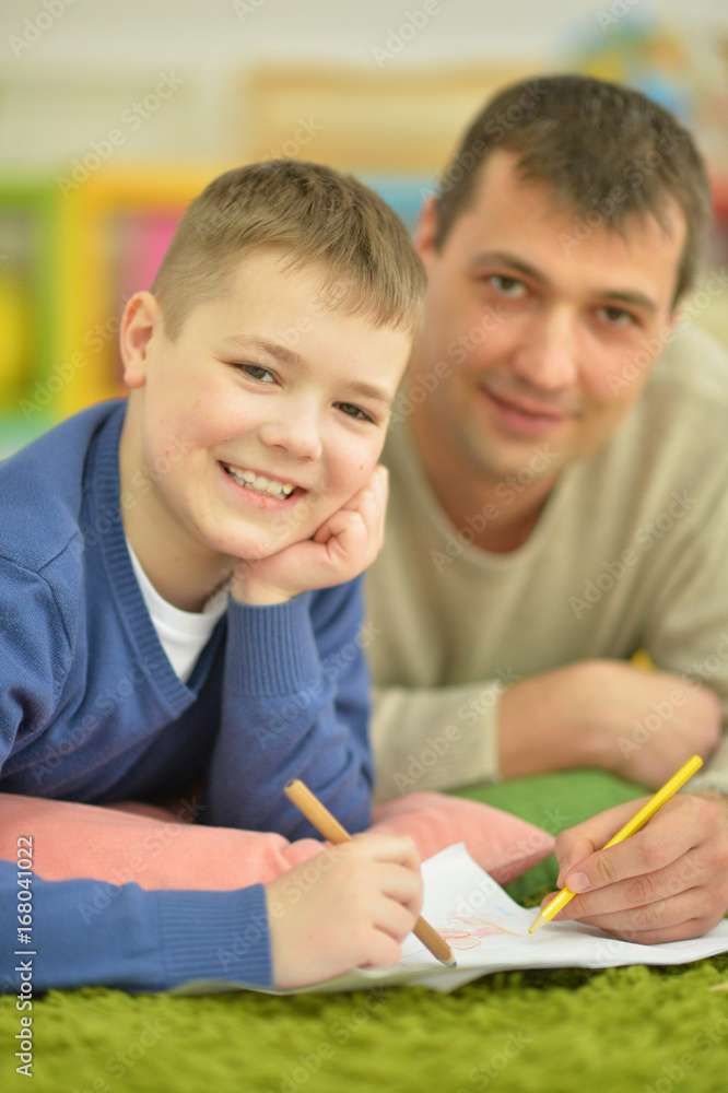 father and son doing homework father and son doing homework