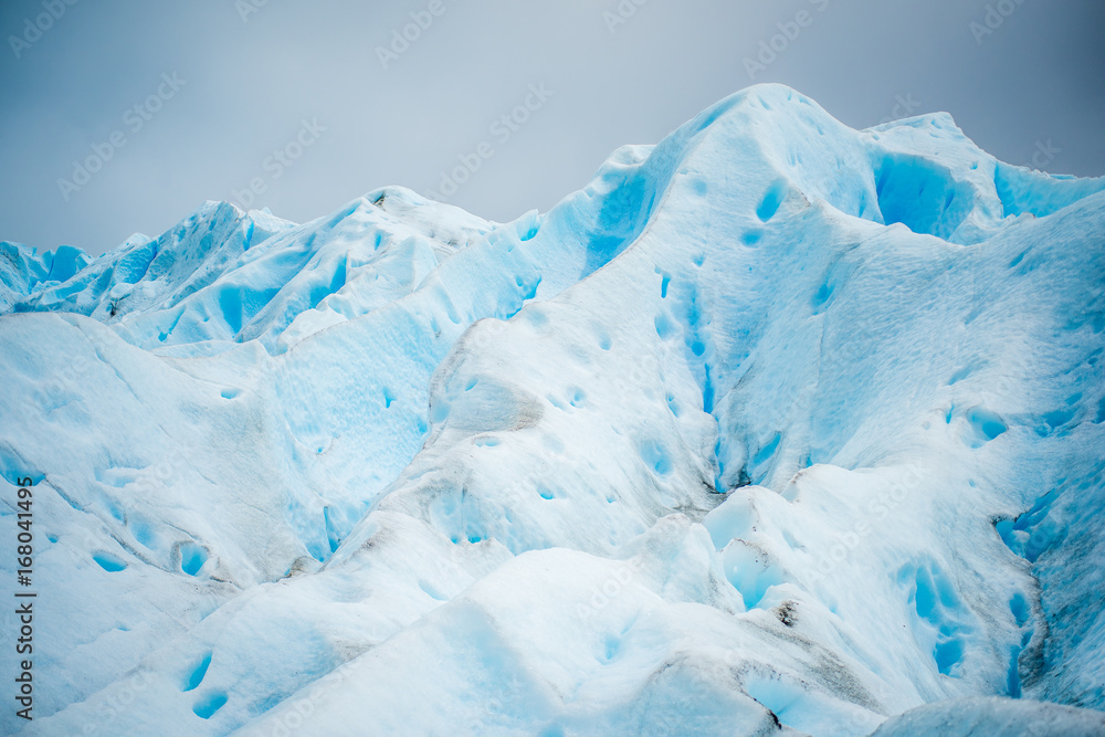 The blue glacier rises and shines in the daylight. Shevelev. The blue glacier rises and shines in the daylight. Shevelev.