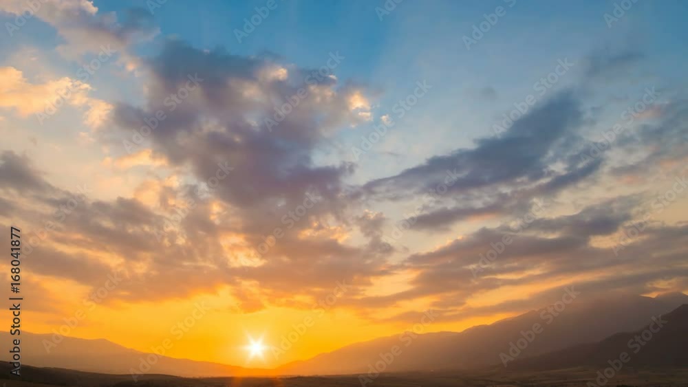 The picturesque sunrise on the cloud stream background. time lapse The picturesque sunrise on the cloud stream background. time lapse