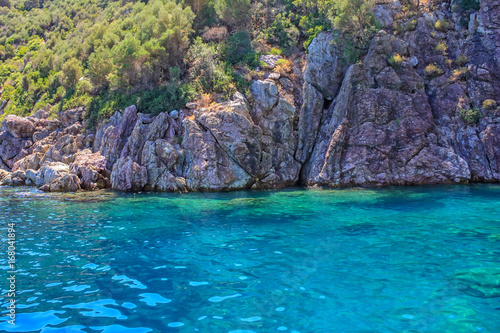 Turquoise water and rocky shore © Yakov