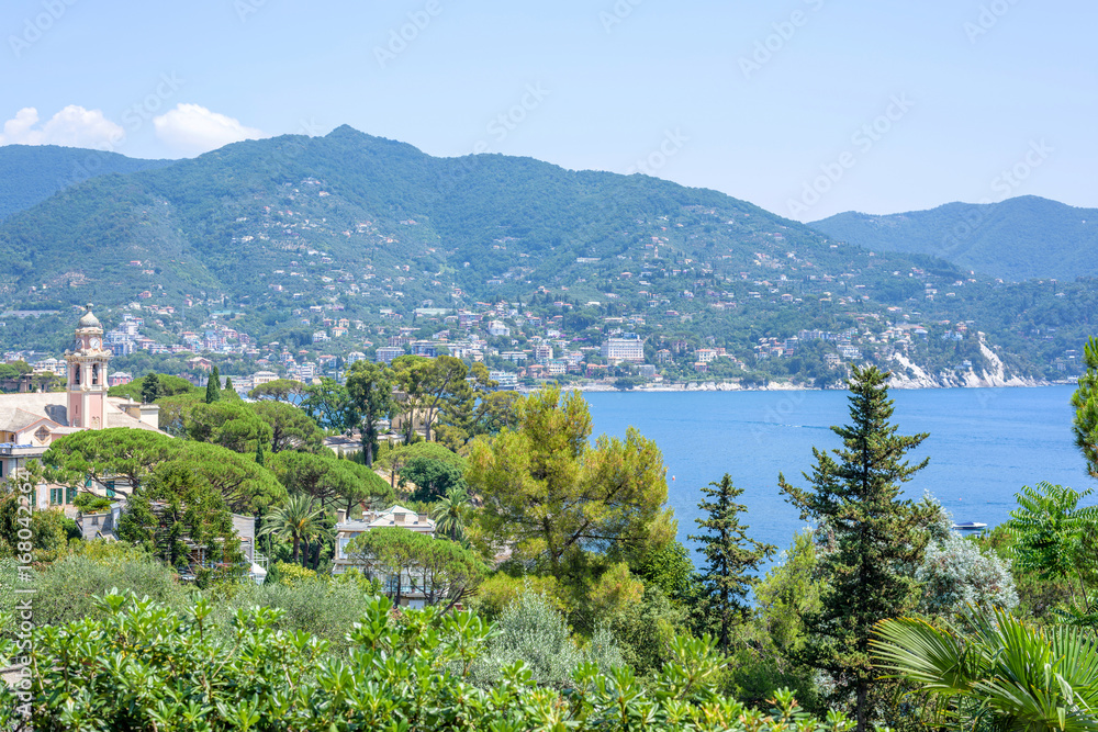 Daylight view to mountains, blue sea and city of Rapallo, Italy.