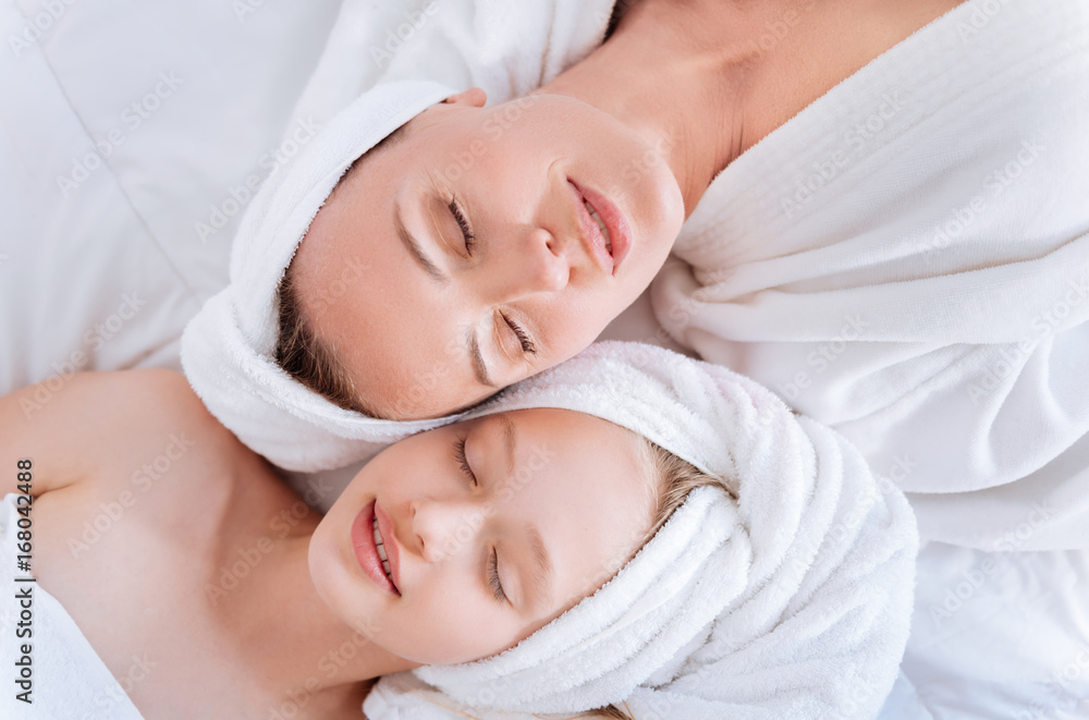Dreamy girls lying with close eyes Dreamy girls lying with close eyes