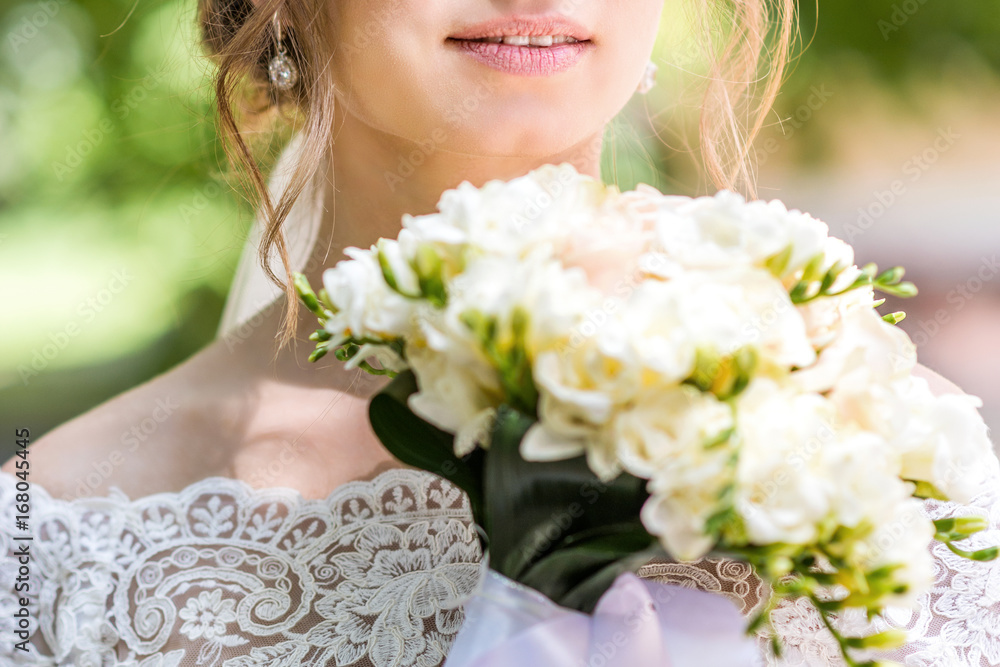 Fototapeta premium Bouquet in bride's hands