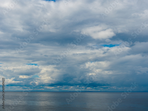Gloomy clouds hovered over the surface of the sea