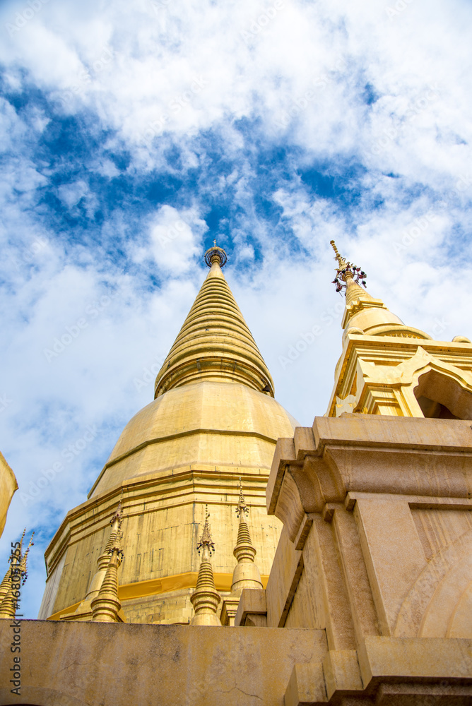 Large golden temple with sky background, Name is Phra Maha Chedi Srivang Chai, Located in Lamphun, Thailand. Large golden temple with sky background, Name is Phra Maha Chedi Srivang Chai, Located in Lamphun, Thailand.
