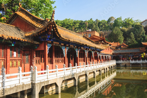 Traditional Chinese Buddhist temple with a pond