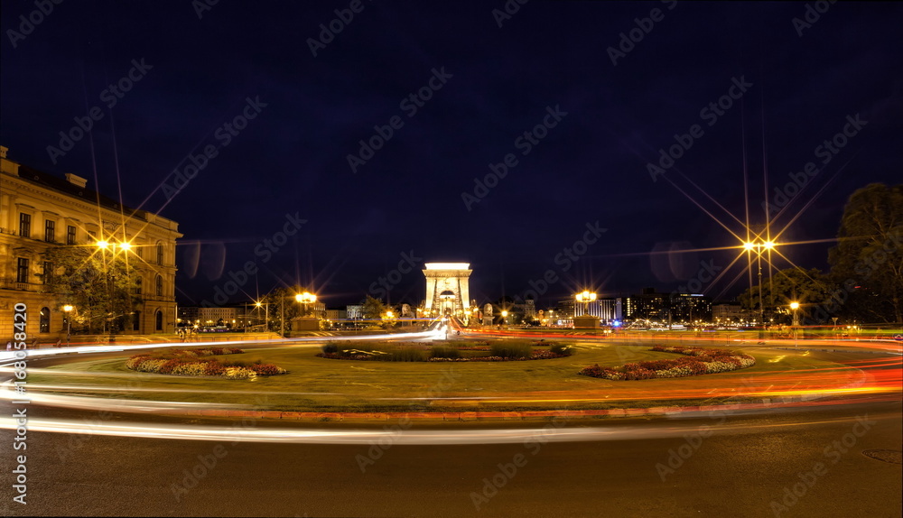 Chain Bridge in Budapest at night with roundabout.