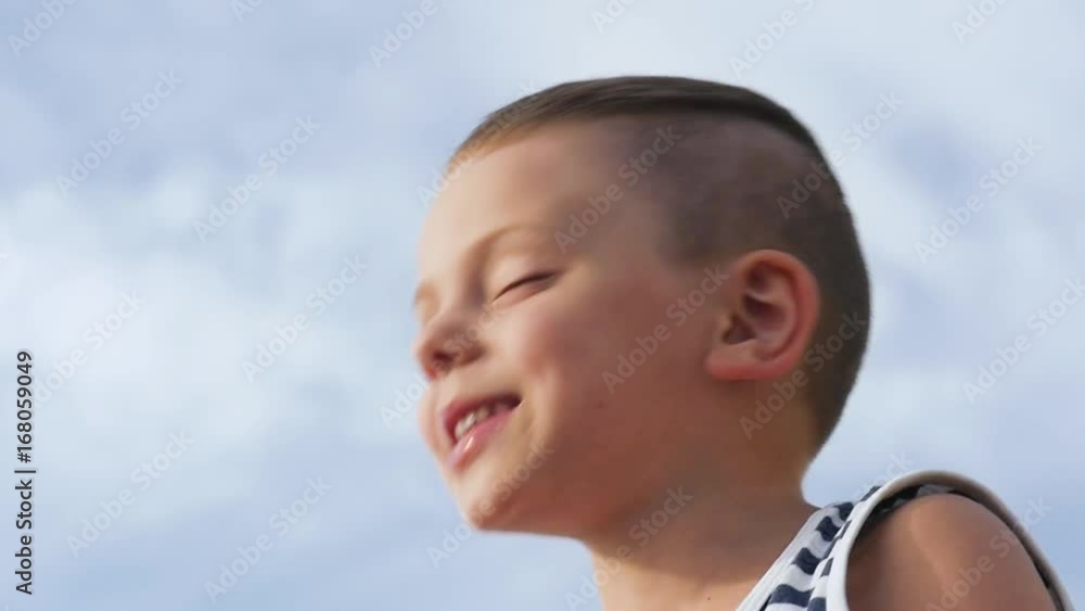Portrait of happy boy with emotions and feelings. Caucasian young boy smiling, looking at camera with joyful smile, male child with glad expression on face. Closeup Portrait of happy boy with emotions and feelings. Caucasian young boy smiling, looking at camera with joyful smile, male child with glad expression on face. Closeup