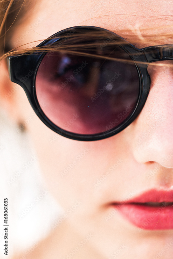 Pretty girl in round sunglasses Pretty girl in round sunglasses