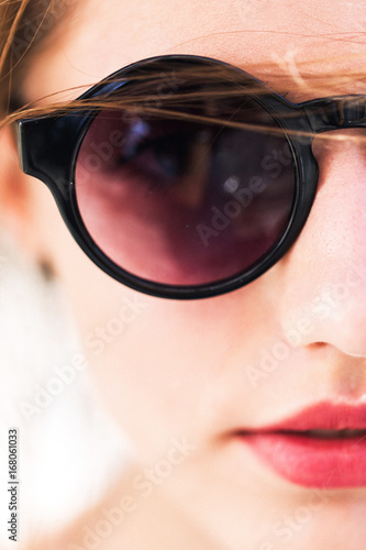 Pretty girl in round sunglasses