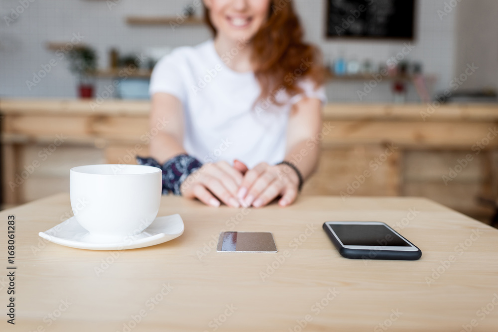 coffee cup, smartphone and card on table coffee cup, smartphone and card on table