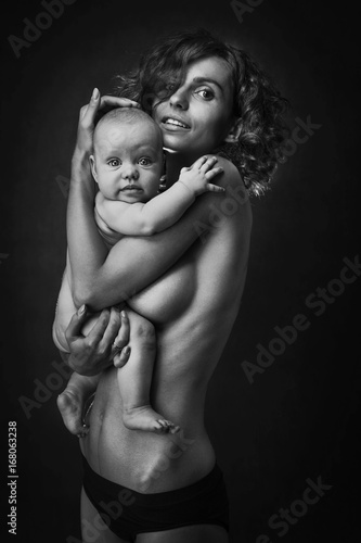 Young mother holding a baby in her arms