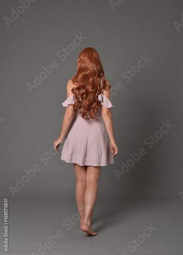 Принти на полотні full length portrait of pr a pretty girl wearing simple purple dress, standing p