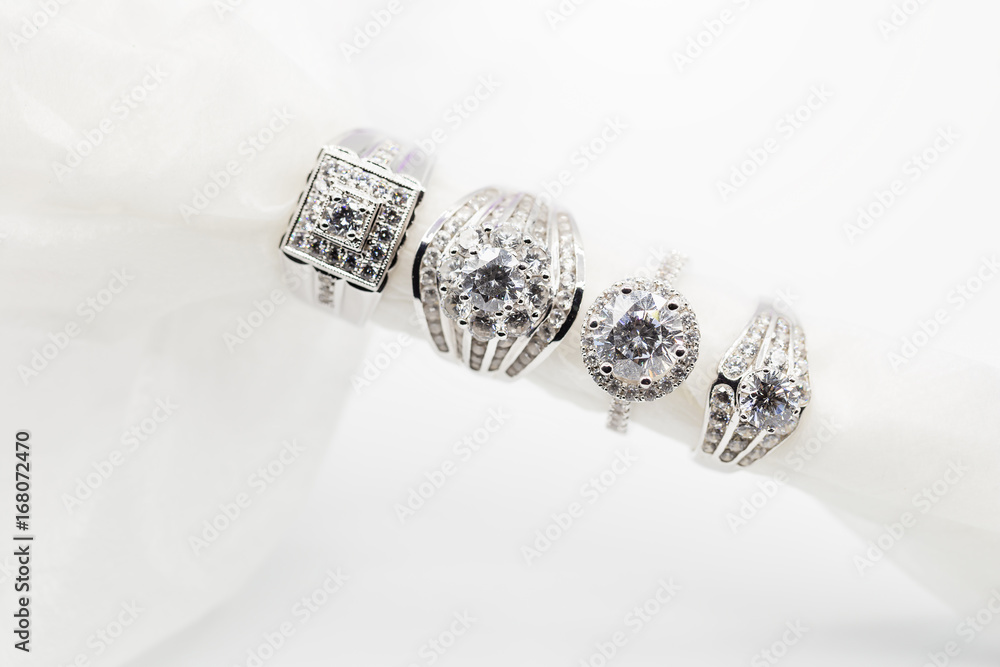 Diamond wedding rings on the white. selective focus Diamond wedding rings on the white. selective focus