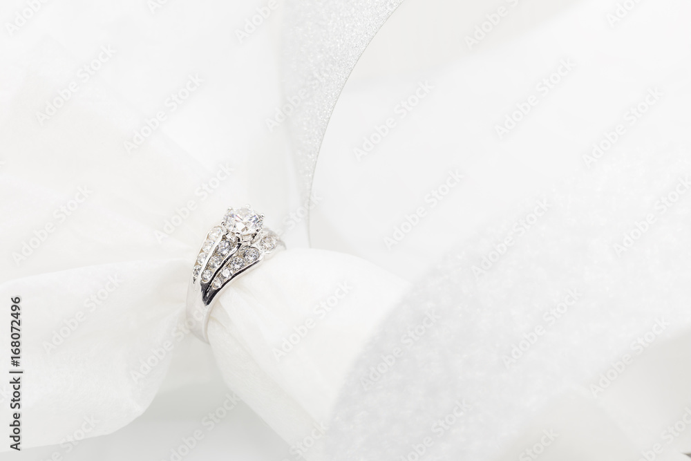 Diamond wedding rings on the white. selective focus Diamond wedding rings on the white. selective focus