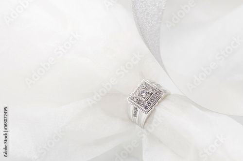 Diamond wedding rings on the white. selective focus