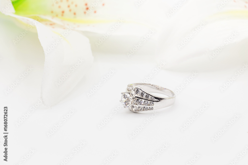 Diamond wedding rings on the white. selective focus Diamond wedding rings on the white. selective focus