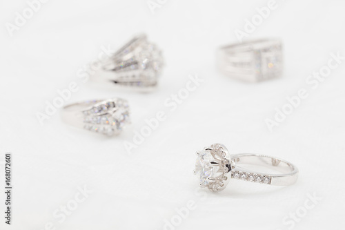Diamond wedding rings on the white. selective focus