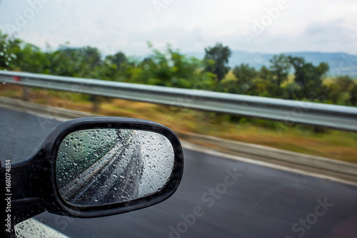 Driving a car on a highway during the rainy day