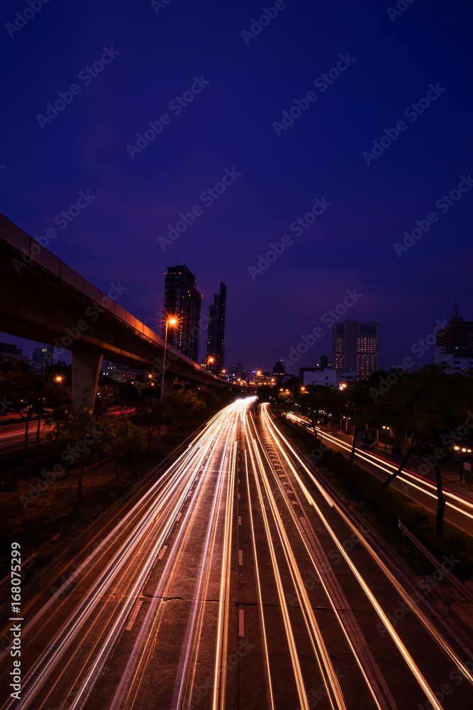 abstract light tail on twilight time in cityscape view