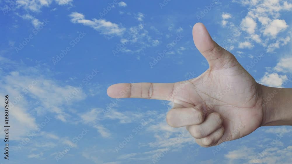 Mail icon on finger over blue skywith whie cloud, Contact us concept Mail icon on finger over blue skywith whie cloud, Contact us concept