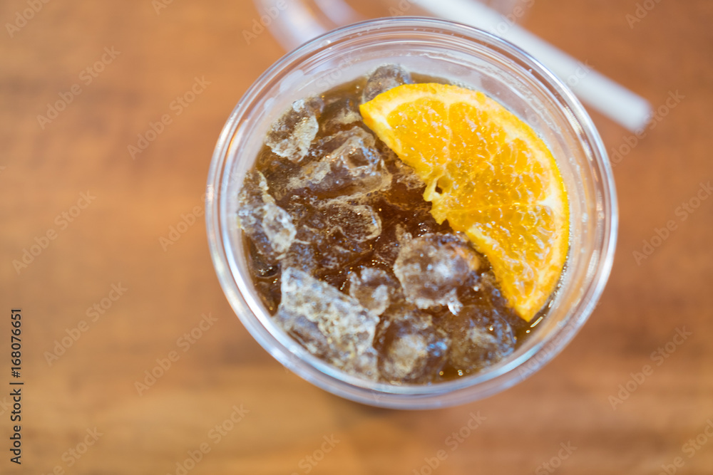 Ice americano with piece of orange Ice americano with piece of orange