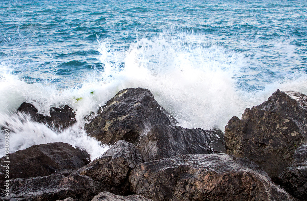 Sea waves in sunset with rocks and stones. Nature landscape. Sea waves in sunset with rocks and stones. Nature landscape.