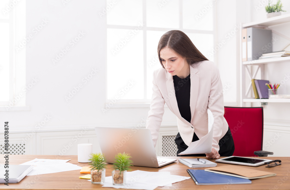 Business woman working on laptop at office Business woman working on laptop at office
