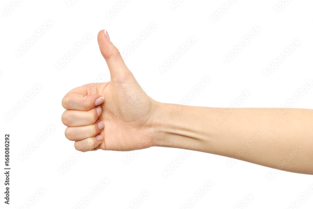 Closeup of female hand showing thumbs up sign Closeup of female hand showing thumbs up sign