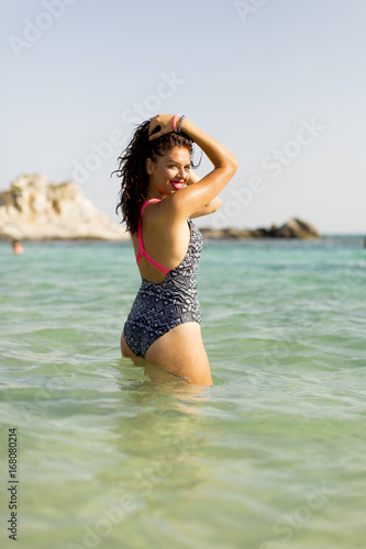 Fototapeta Naklejka Na Ścianę i Meble -  Woman standing in the sea water