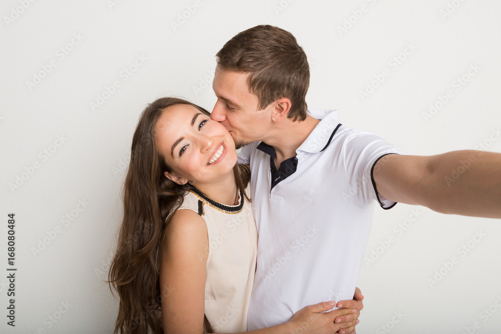 Young loving couple taking selfie on camera Young loving couple taking selfie on camera