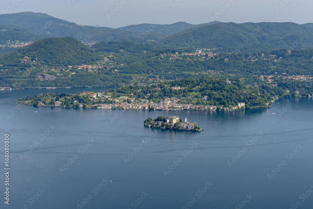aerial of Orta lake with san Giulio island west side and Orta san Giulio village at Orta lake, Italy
