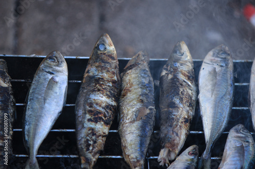 Freshly grilled sardines on the grill