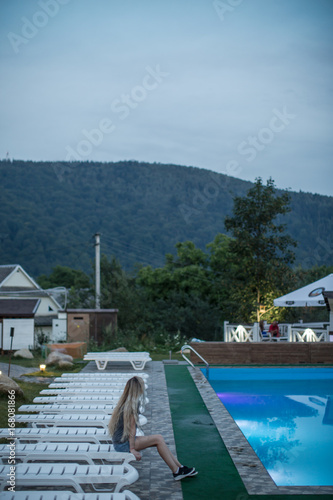 Women at pool in enjoying mountain view