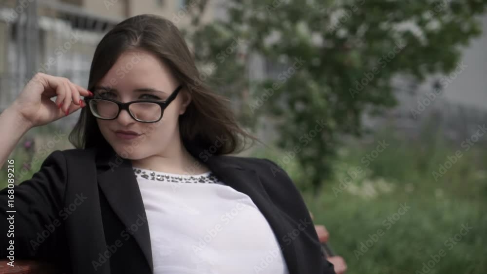 Pretty woman on park bench Pretty woman on park bench