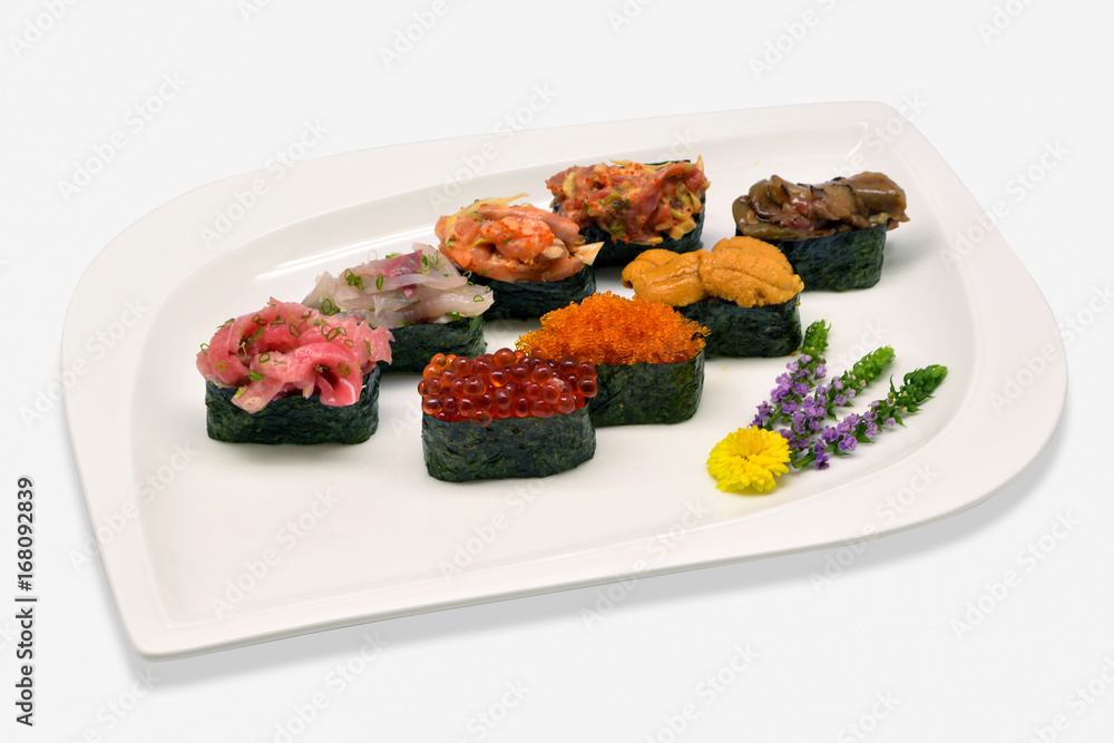 Mixed nigiri sushi (Uni(sea urchin), Ikura (salmon roe), Tobiko (flying fish roe), Otoro,Shutoro, salmon) in white plat on white background