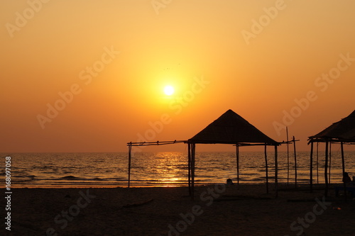 Small bungalow on the beach in Goa, India. Sunset time.