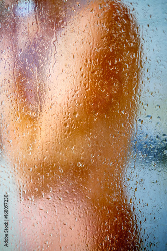 blurred image of a girl taking a shower