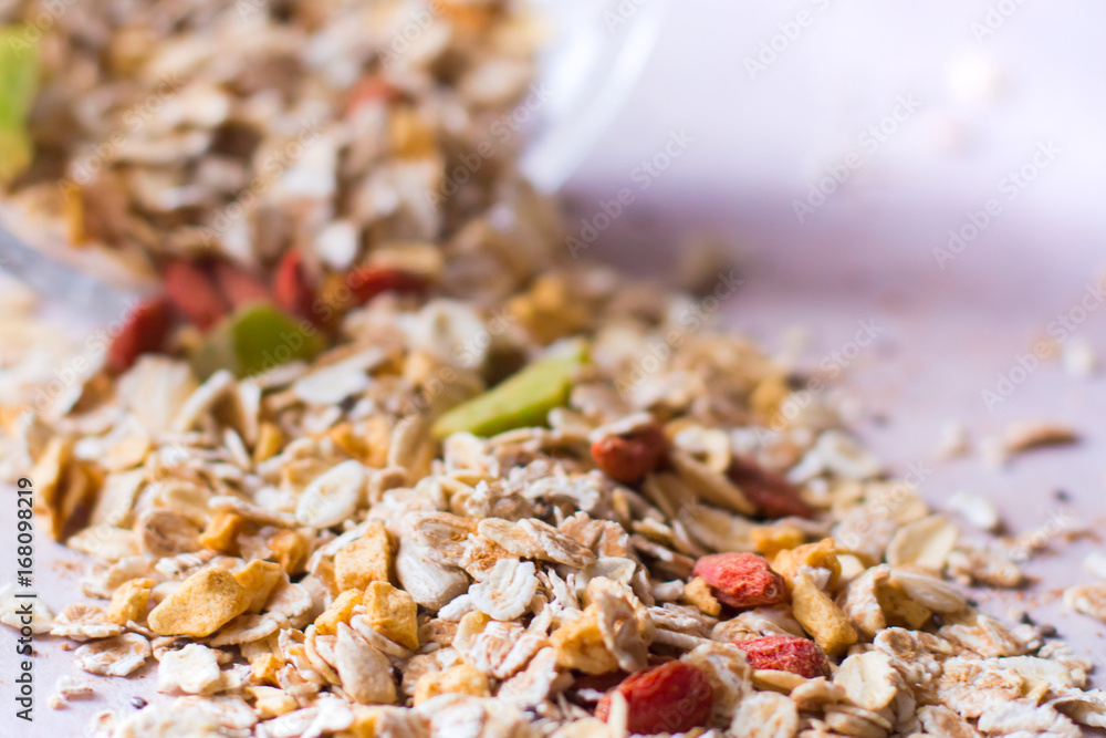 Plate of homemade muesli with cornflakes, Goji berries, chia seeds, freezedried apricot, sunflower seeds, cinnamon. Plate of homemade muesli with cornflakes, Goji berries, chia seeds, freezedried apricot, sunflower seeds, cinnamon.