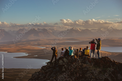 Big group of friends on mountains top