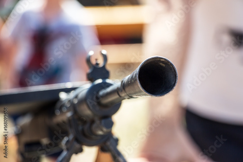 Selective focus. The barrel of a machine gun close-up