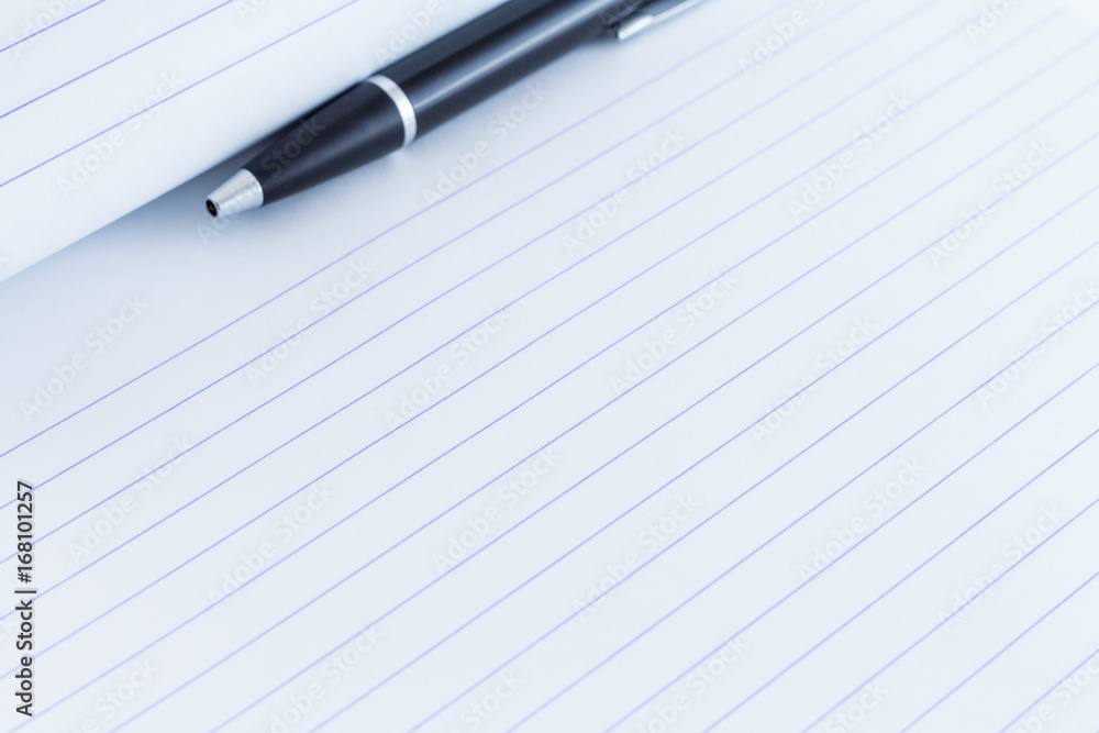 Black writing pen on paper background Black writing pen on paper background